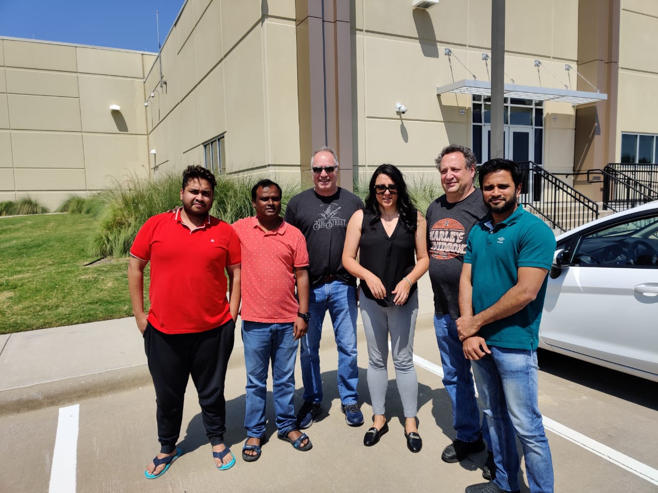 Atoosa Biglari with colleagues at the Avon migration's critical Plano, Texas cutover site