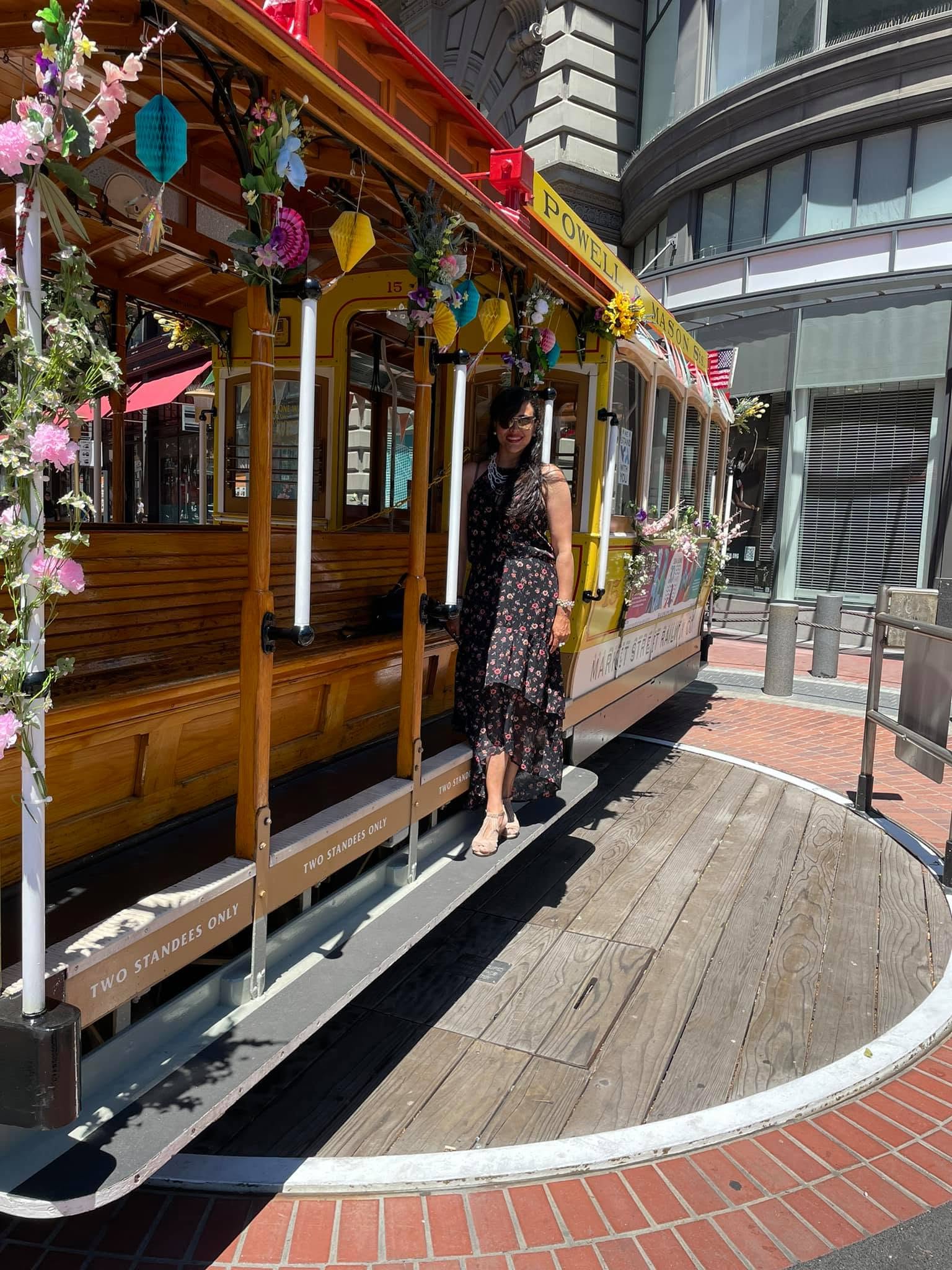 Atoosa on a San Francisco cable car, 2023